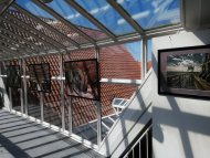 Glasgang Wiedenbrück Gezeigt werden Bilder einer Ausstellung der Artothek im Glasgang der Bibliothek Wiedenbrück