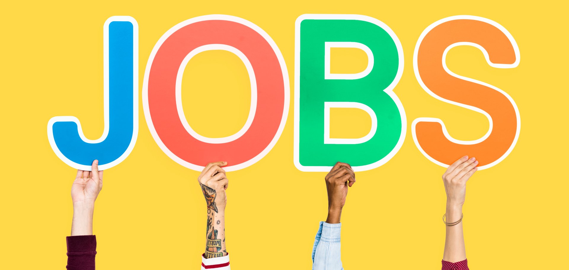 Hands holding up colorful letters forming the word jobs